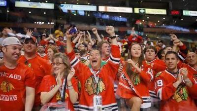 Fans of Chicago Blackhawks celebrate after their team defeated Boston Bruins to win the Stanley Cup in Game 6 of their NHL finals hockey series in Boston.