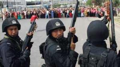 Members of the Uighur ethnic minority in Urumqi, China, rally earlier this month. The Chinese embassy in Abu Dhabi says that minority and religious rights are well protected inside China.