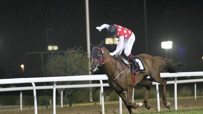 Darius Du Paon charges to victory in the Sheikh Zayed bin Sultan Al Nahyan National Day Cup race in Abu Dhabi. Reem Mohammed / The National