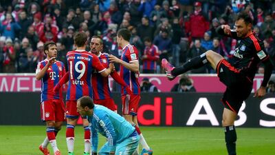 Jaroslav Drobny, keeper of Hamburg reacts with his team mate Heiko Westermann (R) whilst Franck Ribery of Muenchen celebrates scoring the 7th goal during the Bundesliga match between FC Bayern Muenchen and Hamburger SV at Allianz Arena on February 14, 2015 in Munich, Germany. (Photo by Alexander Hassenstein/Bongarts/Getty Images)