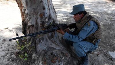 An Afghan security official stands guard on a roadside after the Taliban announced the start of their annual spring offensive, in Jalalabad, Afghanistan, April 28, 2017. Ghulamullah Habibi / EPA