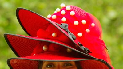 Alice Ascoli attends Ladies Day in a hat made of three hats in 2004. Getty Images
