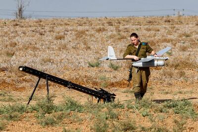 An Israeli soldier prepares an Elbit Systems Skylark I unmanned aerial vehicle (UAV or drone) for take-off near the border with the Gaza Strip in southern Israel in 2020. AFP