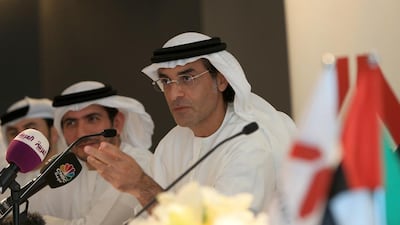 Khadem Al Qubaisi, right, the Arabtec chairman, and board members Khalifa Al Mehairi, left, and Mohamed Al Fahim talk to media during a press conference. Ravindranath K / The National