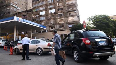 Egyptian drivers wait in line with their vehicles at a petrol station in Cairo. Egyptian GDP growth is forecast to rise to 5 per cent, from a projected 4.2 per cent in the 2014-15 financial year that ends next week. AFP