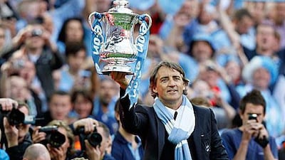 Mancini celebrates the spoils for his hard work.