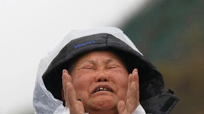 The family member of a missing passenger from the capsized South Korean ferry “Sewol” cries at a port where family members have gathered to wait for news from rescuers. Kim Hong-Ji/ Reuters