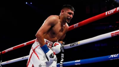 Amir Khan in visible discomfort after a low blow shot from Terence Crawford. Action Images via Reuters/Andrew Couldridge