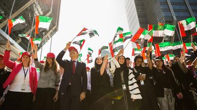 Staff at TAQA’s headquarters in Abu Dhabi celebrate Flag Day at Sowwah Square. Photo Courtesy TAQA