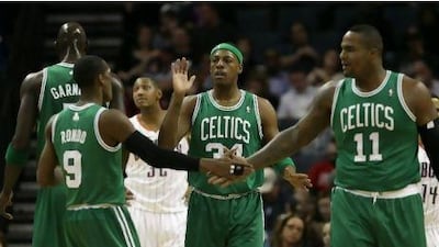Paul Pierce, centre with Rajesh Rondo, left, and Glen Davis, right, is one of a number of players in the Boston Celtics side, who lead the Eastern Conference, over the age of 30. Streeter Lecka / Getty Images
