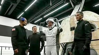 Chris Sembroski celebrates their return to Earth. AP