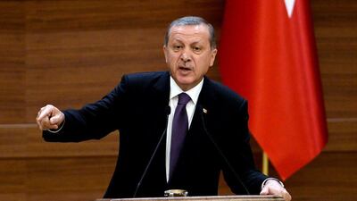 Turkish President Recep Tayyip Erdogan delivers a speech during the mukhtars meeting at the presidential palace in Ankara on November 4, 2015. The AKP, founded by Mr Erdogan, won a resounding victory in Sunday’s national election, but is still 13 seats short of the 330 required to call a referendum on any constitutional change. Adem Altan / Agence France-Presse