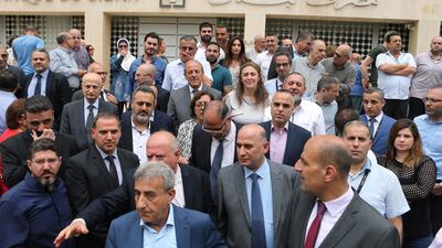 Employees of the Lebanese central bank gather during a strike over state budget proposals that would cut their benefits, in front of the central bank in Beirut, Lebanon May 6, 2019. Reuters