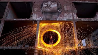 Palestinians light fireworks above the rubble to celebrate the holy month of Ramadan in Gaza City, AP Photo