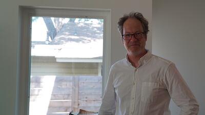 Jake Wegmann, a professor in the school of architecture at the University of Texas, in his home.