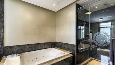 This bathroom has a stylish marble finish.