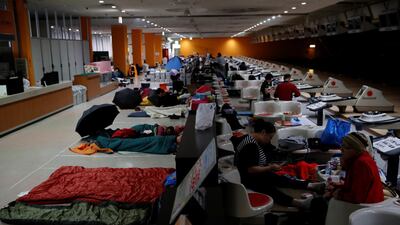 Spectators who evacuate from Typhoon Hagibis, gather at a makeshift accommodation for spectators of Formula One Japanese Grand Prix at Suzuka Circuit in Suzuka, central Japan. Reuters