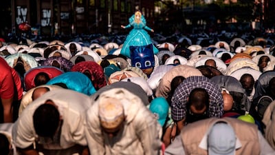 Muslims attend a morning prayer at the industrial wasteland of Parco Dora in Turin on the first day the Eid al-Adha. AFP