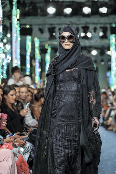 The collection featured longer hemlines and custom-made abayas. Victor Besa / The National