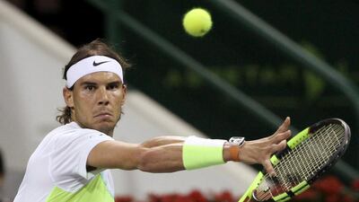 Rafael Nadal of Spain returns the ball to Robin Haase of the Netherlands during their Qatar Open men’s single tennis match in Doha, Qatar January 6, 2016. Naseem Zeitoon / Reuters