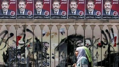 Election posters for Mohammed Morsi, the Muslim Brotherhood's new presidential candidate, in Cairo yesterday.