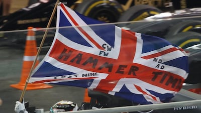 Hamilton celebrates on his victory lap. Marwan Naamani / AFP Photo.