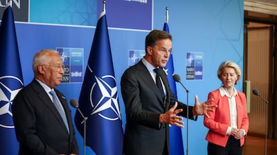 Nato Secretary General Mark Rutte, centre, speaks to the media next to European Commission President Ursula von der Leyen and European Council President Antonio Costa. Reuters