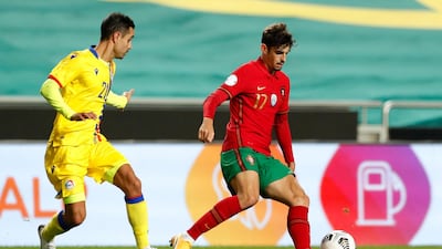 Portugal's Francisco Trincão, right, on the ball against and Andorras' Marc Garcia. AP