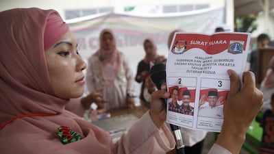 Election workers count ballots at a polling station in Jakarta, Indonesia, 19 April 2017 as Indonesians vote in a local election for Jakarta's governor after a bitter campaign with religious tensions following the blasphemy trial involving the incumbent governor Basuki 'Ahok' Tjahaja Purnama. Adi Weda/EPA