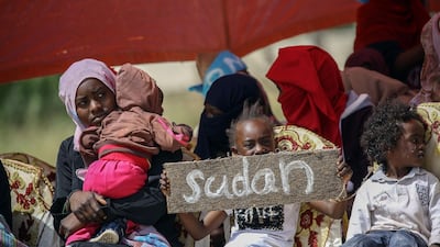Migrants wait for Antonio Guterres's arrival arrival to Ain Zara detention centre for migrants. AFP
