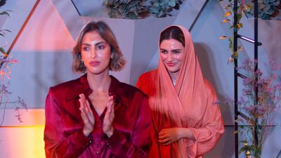 Fashion designer Sara Tamimi, right, with a model wearing one of her creations.