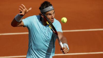 Rafael Nadal of Spain returns the ball to Andy Murray of Britain during their men's semi-final match at the French Open tennis tournament at the Roland Garros stadium in Paris June 6, 2014. REUTERS/Jean-Paul Pelissier