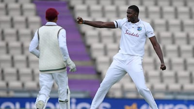West Indies bowler Jason Holder celebrates taking the wicket of England's Ben Stokes. AFP