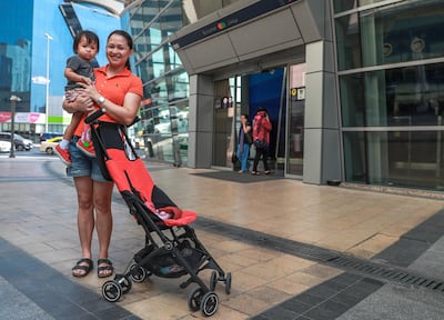 Ronalyn Adolfo and her daughter Zuri, 1, at Burjuman Metro Station. Victor Besa/ The National