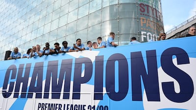 Manchester City's players on the an open-top bus parade. AFP