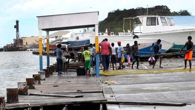 People recover broken parts of the dock after the passing of Hurricane Irma, in St. John's, Antigua. Johnny Jno-Baptiste / AP Photo