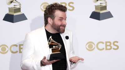 Taylor Eigsti pose in the press room with his Grammy for Best Contemporary Instrumental Album for 'Tree Falls,' during the 64th annual Grammy Awards. EPA
