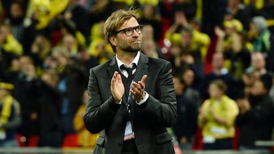 Jurgen Klopp shown applauding fans after a Champions League match in May 2013 with Borussia Dortmund. Andy Rain / EPA