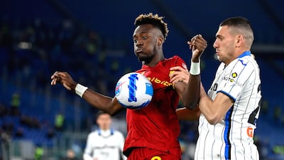 Roma striker Tammy Abraham under pressure from Atalanta's Merih Demiral. EPA