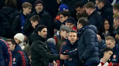 Mikel Arteta, left, shakes hands with Chelsea manager ead coach Frank Lampard. AP