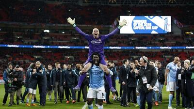 Manchester City's Willy Caballero and Wilfried Bony celebrate winning the match after a penalty shootout. Action Images via Reuters / Carl Recine