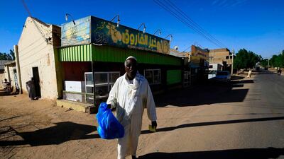 Sudanese people buy bread at a bakery in the town of Atbara, an industrial town 350 kilometres northeast of Sudan's capital Khartoum. AFP