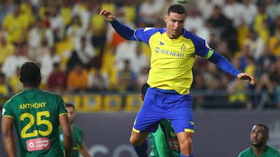 Cristiano Ronaldo jumps for a header during the Saudi Pro League football match between Al Nassr and Al Khaleej.
