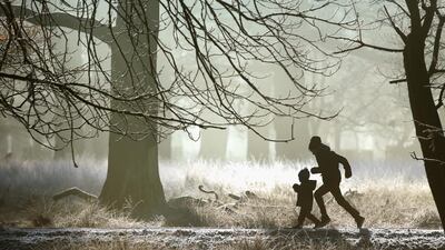 A young family enjoy a brisk early morning walk as overnight frost clings to the fauna and flora at the National Trust’s Dunham Massey Park in Altrincham, United Kingdom. Christopher Furlong / Getty