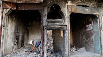 A member of a demining squad takes part in an operation to clear mines in the Old City of Mosul.
