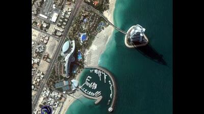 From a low-earth orbit can detect objects as small as 50cm on the ground 770km below like the Burj Al Arab in Dubai below. Courtesy of DigitalGlobe