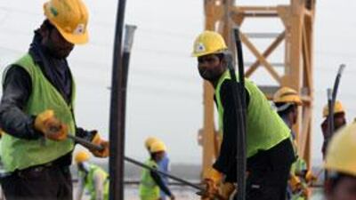 Laborers work around the clock to finish the Yas Island project.