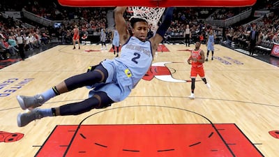 Memphis Grizzlies' Kobi Simmons dunks the ball during the second half of an NBA basketball game against the Chicago Bulls. Charles Rex Arbogast / AP Photo