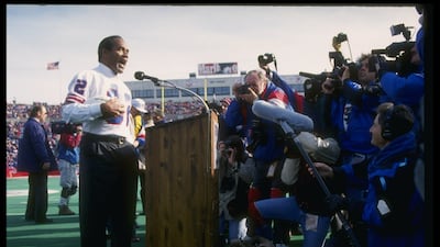 Simpson speaks during a half-time ceremony during a game between the Buffalo Bills and the Indianapolis Colts in November 1993. Allsport / Getty Images