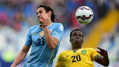 Coach Winfried Schafer was proud of the way Jamaica, in yellow, played against defending champions Uruguay. Ronaldo Schemidt / AFP